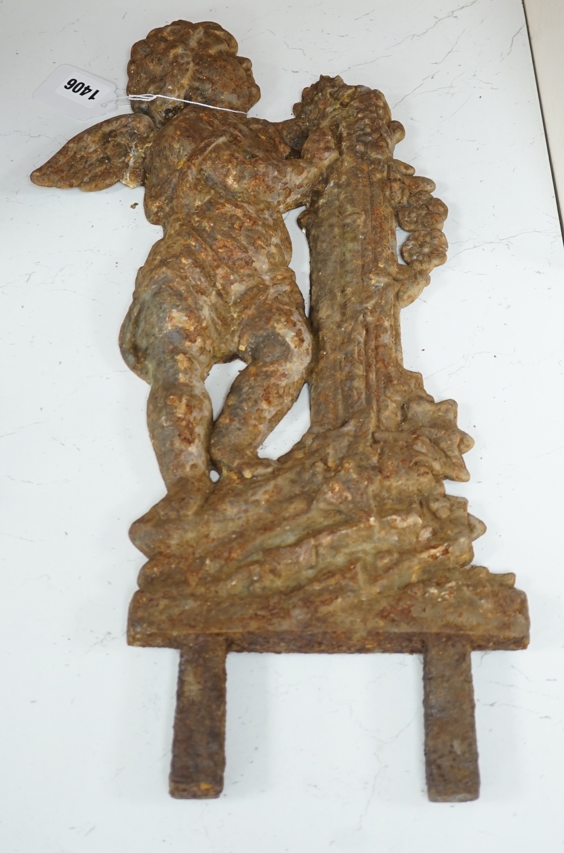 A cast iron putto mount. 50cm tall